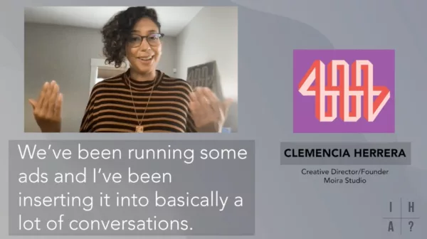 A woman wearing glasses and a striped shirt.