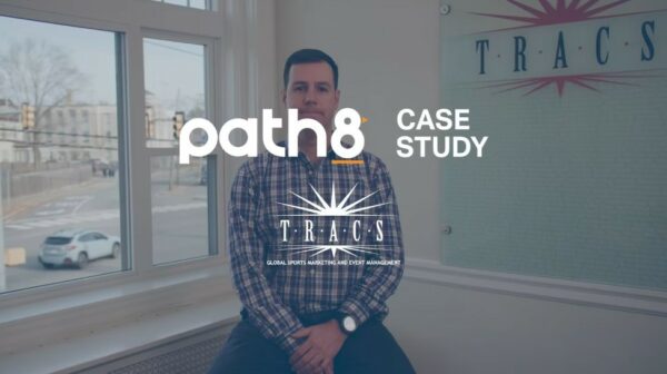 A man sitting in front of a window, showcasing the path8 case study for a Boston Video Production Company.